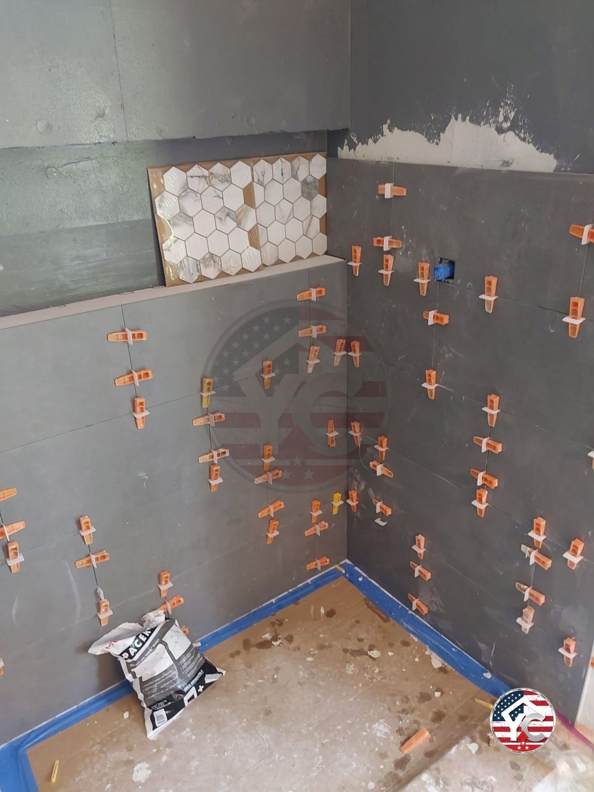 Marble hexagon mosaic staged for installation