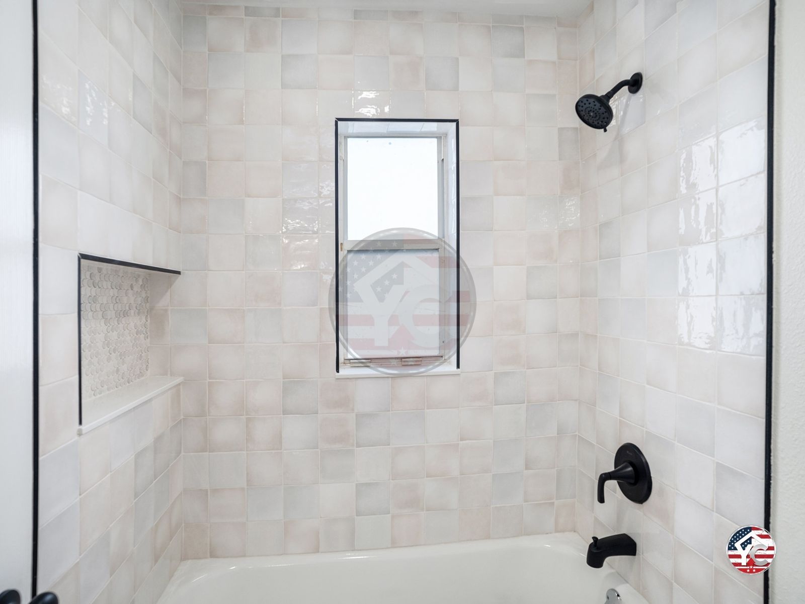 Finished tub-shower combo with cream tile